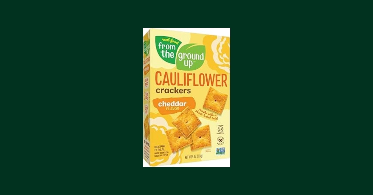 Box of From the Ground Up Cauliflower Crackers in Cheddar flavor showing product branding and nutritional claims