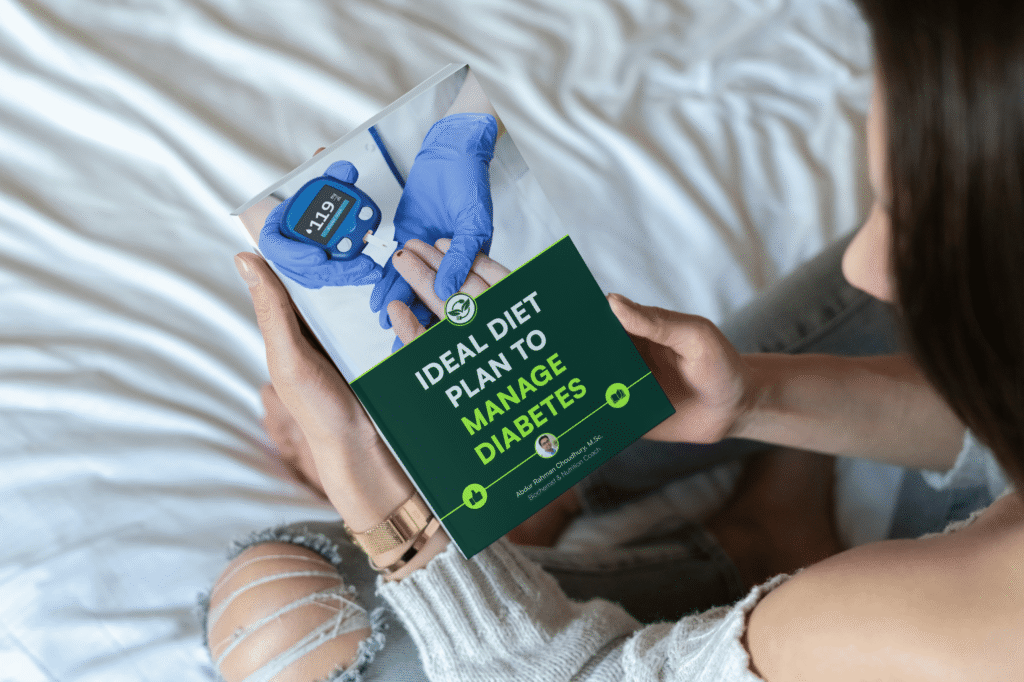 Woman with ripped jeans reading diabetes diet plan ebook while sitting on white bedsheets