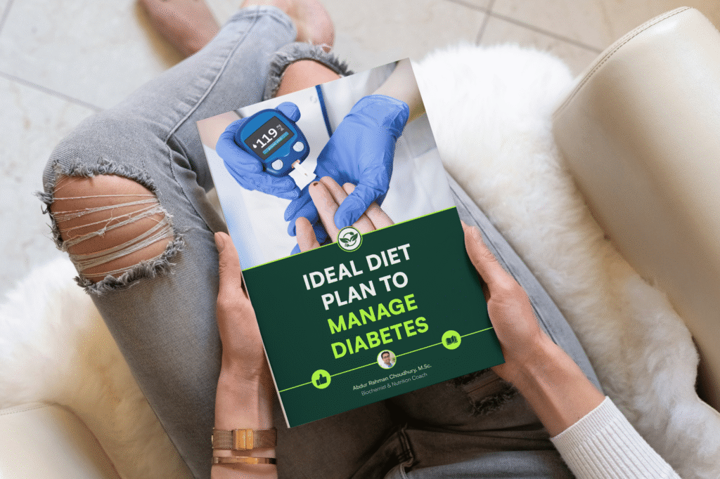 Woman with ripped jeans and gold watch holding diabetes diet plan ebook while seated on cream sofa