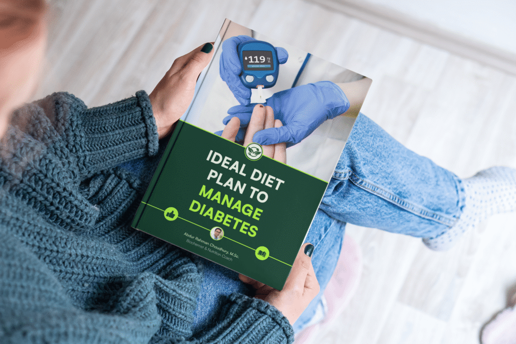 Woman in teal sweater holding Ideal Diet Plan to Manage Diabetes ebook showing glucose meter cover